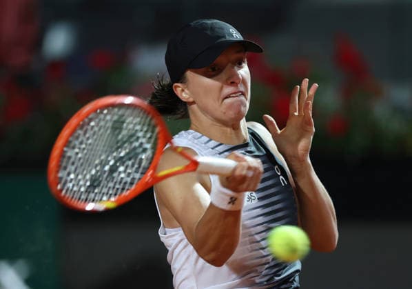 (260515) -- ROME, May 15, 2026 -- Iga Swiatek of Poland hits a return during the women s singles semifinal match between Elina Svitolina of Ukraine and Iga Swiatek of Poland at the WTA, Tennis Damen Italian Open in Rome, Italy, May 14, 2026. ) (SP)ITALY-ROME-TENNIS-WTA-ITALIAN OPEN-ELINA SVITOLINA VS IGA SWIATEK LixJing 