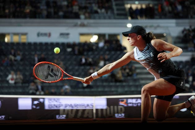 (260515) -- ROME, May 15, 2026 -- Iga Swiatek of Poland hits a return during the women s singles semifinal match between Elina Svitolina of Ukraine and Iga Swiatek of Poland at the WTA, Tennis Damen Italian Open in Rome, Italy, May 14, 2026. ) (SP)ITALY-ROME-TENNIS-WTA-ITALIAN OPEN-ELINA SVITOLINA VS IGA SWIATEK LixJing 
