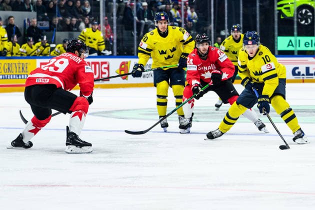 260515 Parker Wotherspoon and Dylan Cozens of Canada and Simon Holmström of Sweden during the 2026 IIHF Ice hockey, Eishockey World Championship, WM, Weltmeisterschaft match between Canada and Sweden on May 15, 2026 in Fribourg. Photo: Jesper Zerman BILDBYRAN kod JZ JZ0714 ishockey ice hockey ishockey-vm 2026 vm 2026 iihf world championship kanada canada sverige sweden bbeng Copyright: JESPERxZERMAN BB260515BB167