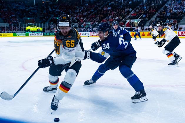ZURICH, SWITZERLAND - MAY 15: Marc Michaelis (Germany, 65) in the battle for the puck with Aatu Raety (Finland, 34) during the Preliminary Round - Group A Match 1 between Finland and Germany at the IIHF Ice hockey, Eishockey World Championship, WM, Weltmeisterschaft 2026, Swiss Life Arena on May 15, 2026 in Zurich, Switzerland. Zurich Switzerland Copyright: xTimoxSteinx