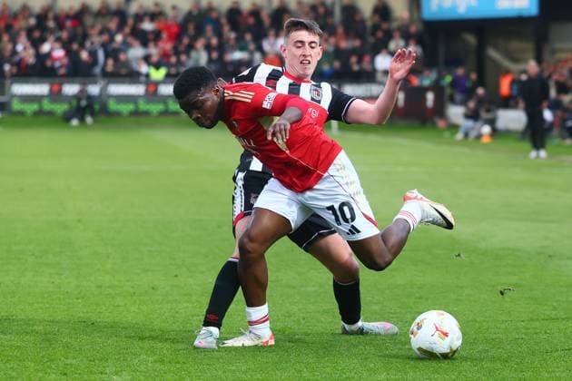 Kelly N Mai of Salford City and Darragh Burns of Grimsby Town Salford City v Grimsby Town, EFL Sky Bet League Two, Play-Off Semi Final, Second Leg, Football, Peninsula Stadium, Salford, UK - 15 May 2026Salford Peninsula Stadium United Kingdom EDITORIAL USE ONLY No use with unauthorised audio, video, data, fixture lists, club league logos or live services. Online in-match use limited to 120 images, no video emulation. No use in betting, games or single club league player publications. Copyright: xPaulxCurrie Shutterstockx 16876823bt