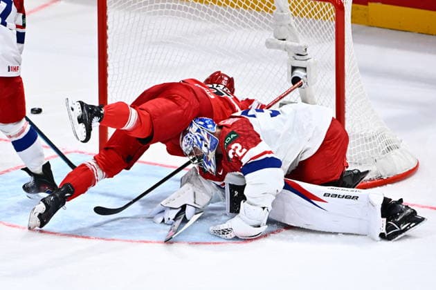 Nick Olesen of Denmark, left, and goalkeeper Josef Korenar of Czech Republic in action during the IIHF World Championship, WM, Weltmeisterschaft Group B match Czech Republic vs Denmark on May 15, 2026, Fribourg, Switzerland. (CTKxPhoto RadekxPetrasek) CTKPhotoP2026051508564  CTKPhotoP2026051508564
