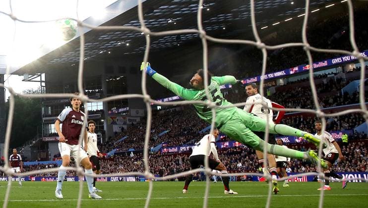 Giorgi Mamardashvili of Liverpool dives but fails to save the opening goal scored by Morgan Rogers of Aston Villa Aston Villa v Liverpool, Premier League, Football, Villa Park, Birmingham, UK - 15 May 2026Birmingham Villa Park United Kingdom EDITORIAL USE ONLY No use with unauthorised audio, video, data, fixture lists, club league logos or live services. Online in-match use limited to 120 images, no video emulation. No use in betting, games or single club league player publications.  Copyright: xKieranxMcManus Shutterstockx 16876814ak