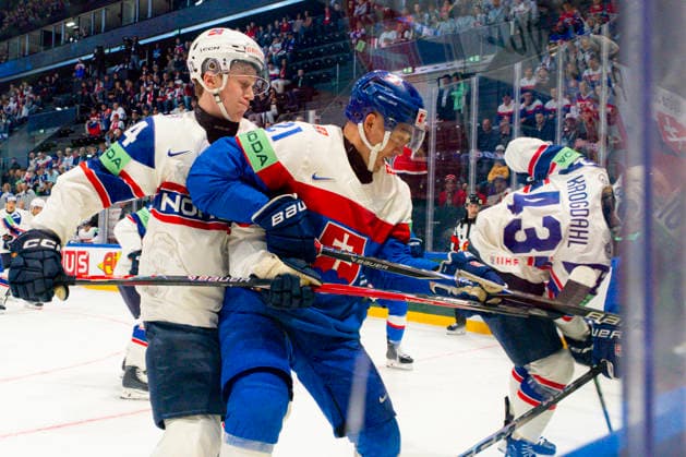 FRIBOURG, SWITZERLAND - MAY 16: Tinus Luc Koblar of Norway L) against Sebastian Cederle of Slovakia C) during the 2026 IIHF Ice hockey, Eishockey World Championship, WM, Weltmeisterschaft Switzerland game between Slovakia and Norway at BCF Arena on May 16, 2026 in Fribourg, Fribourg. Fribourg BCF Arena Fribourg Switzerland Copyright: xJustPictures.ch JarixPestelaccix jp-en-EuSpIm-JP6_JAR_Slovakia_Norway_16May2026_00028