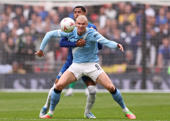 London, England, 16th May 2026. Erling Haaland of Manchester City held up by Levi Colwill of Chelsea during the Chelsea vs Manchester City FA Cup Final match at Wembley Stadium, London. Picture credit should read: David Klein Sportimage EDITORIAL USE ONLY. No use with unauthorised audio, video, data, fixture lists, club league logos or live services. Online in-match use limited to 120 images, no video emulation. No use in betting, games or single club league player publications. SPI_039_DK_Chelsea_Manchester_City SPI-4803-0040