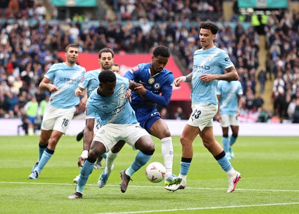 London, England, 16th May 2026. Marc Guehi of Manchester City tackles Jorrel Hato of Chelsea during the Chelsea vs Manchester City FA Cup Final match at Wembley Stadium, London. Picture credit should read: David Klein Sportimage EDITORIAL USE ONLY. No use with unauthorised audio, video, data, fixture lists, club league logos or live services. Online in-match use limited to 120 images, no video emulation. No use in betting, games or single club league player publications. SPI_044_DK_Chelsea_Manchester_City SPI-4803-0045