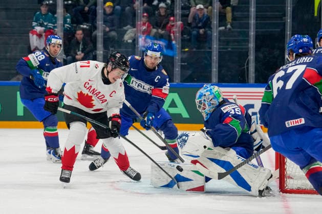 FRIBOURG, SWITZERLAND - MAY 16: Macklin Celebrini of Canada L) against goalkeeper Davide Fadani of Italy during the 2026 IIHF Ice hockey, Eishockey World Championship, WM, Weltmeisterschaft Switzerland game between Italy and Canada at BCF Arena on May 16, 2026 in Fribourg, Fribourg. Fribourg BCF Arena Fribourg Switzerland Copyright: xJustPictures.ch JarixPestelaccix jp-en-EuSpIm-JP6_JAR_Italy_Canada_16May2026_00004