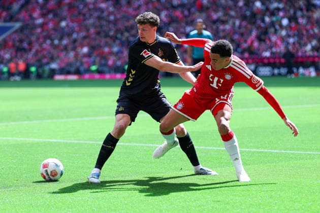 GER; 1. FBL, FC Bayern München vs 1. FC Köln 16.05.2026, Allianz Arena, München, GER; 1. FBL, FC Bayern München vs 1. FC Köln, im Bild picture shows Eric Martel ( 1. FC Köln 6 ), links - Jamal Musiala ( FC Bayern München 10 ), rechts