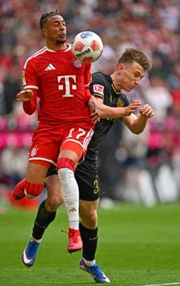 16.05.2026, Fussball Bundesliga 2025 2026, 34.Spieltag, FC Bayern München - 1.FC Köln, in der Allianz-Arena München, v.l. Michael Olise (FC Bayern München) gegen Kristoffer Lund (1.FC Köln)