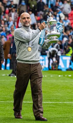 Football - FA Cup - Semi-Final - Chelsea FC v Manchester City FC LONDON, ENGLAND - Saturday, May 16, 2026: Manchester City s Josep Pep Guardiola celebrates with the trophy and his winner s medal after the FA Cup Final between Chelsea FC and Manchester City FC at Wembley Stadium. Man City won 1-0. (Photo by Ian Stephen Propaganda) LONDON Wembley Stadium GREATER LONDON ENGLAND  Copyright: xDavidxRawcliffex P2026-05-16-FA_Cup_Final-53