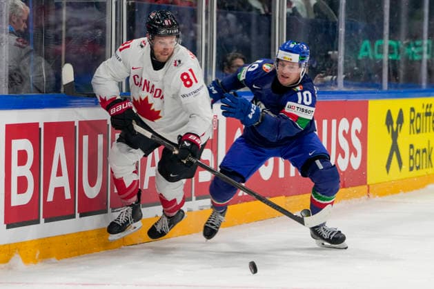 FRIBOURG, SWITZERLAND - MAY 16: Dylan Holloway of Canada L) against Peter Spornberger of Italy R) during the 2026 IIHF Ice hockey, Eishockey World Championship, WM, Weltmeisterschaft Switzerland game between Italy and Canada at BCF Arena on May 16, 2026 in Fribourg, Fribourg. Fribourg BCF Arena Fribourg Switzerland Copyright: xJustPictures.ch JarixPestelaccix jp-en-EuSpIm-JP6_JAR_Italy_Canada_16May2026_00124