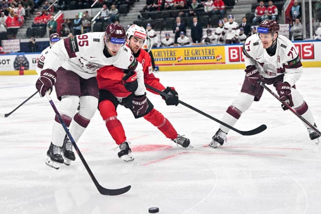 ZURICH, SWITZERLAND - MAY 16: Oskars Batna of Latvia L) and Kristaps Zile of Latvia R) in a battle for the puck with Nico Hischier of Switzerland during the 2026 IIHF Ice hockey, Eishockey World Championship, WM, Weltmeisterschaft Switzerland game between Switzerland and Latvia at Swiss Life Arena on May 16, 2026 in Zurich, Zurich. Zurich Swiss Life Arena Zurich Switzerland *** ZURICH, SWITZERLAND MAY 16 Oskars Batna of Latvia L and Kristaps Zile of Latvia R in a battle for the puck with Nico Hischier of Switzerland during the 2026 IIHF Ice Hockey World Championship Switzerland game between Switzerland and Latvia at Swiss Life Arena on May 16, 2026 in Zurich, Zurich Zurich Swiss Life Arena Zurich Switzerland Switzerland Copyright: xJustPictures.ch AndreaxBrancax jp-en-EuSpIm-JP7_ANB_Sui_Lat_16052026_3585