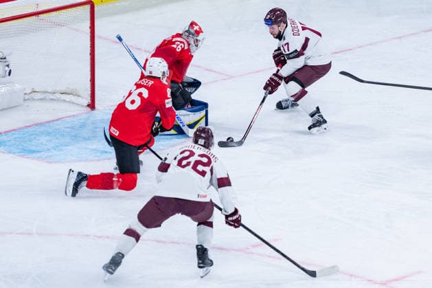 ZURICH, SWITZERLAND - MAY 16: Martins Dzierkals (Latvia, 17) trying to score during the Preliminary Round - Group A Match 9 between Switzerland and Latvia at the IIHF Ice hockey, Eishockey World Championship, WM, Weltmeisterschaft 2026, Swiss Life Arena on May 16, 2026 in Zurich, Switzerland. Zurich Switzerland Copyright: xTimoxSteinx