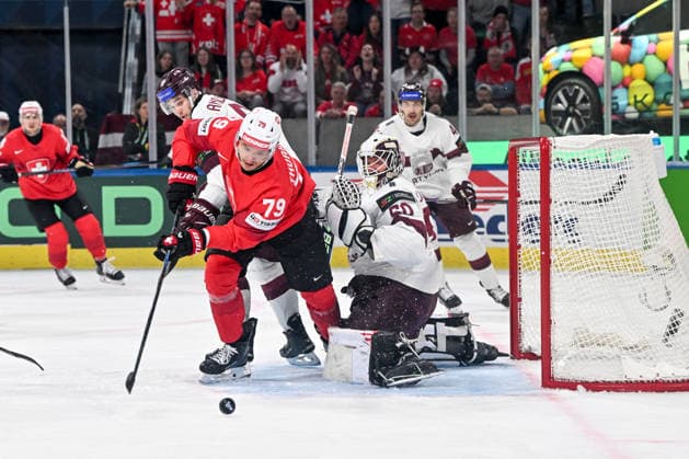 ZURICH, SWITZERLAND - MAY 16: Calvin Thurkauf of Switzerland tries to score against goalkeeper Kristers Gudlevskis of Latvia during the 2026 IIHF Ice hockey, Eishockey World Championship, WM, Weltmeisterschaft Switzerland game between Switzerland and Latvia at Swiss Life Arena on May 16, 2026 in Zurich, Zurich. Zurich Swiss Life Arena Zurich Switzerland Copyright: xJustPictures.ch AndreaxBrancax jp-en-EuSpIm-JP7_ANB_Sui_Lat_16052026_4260