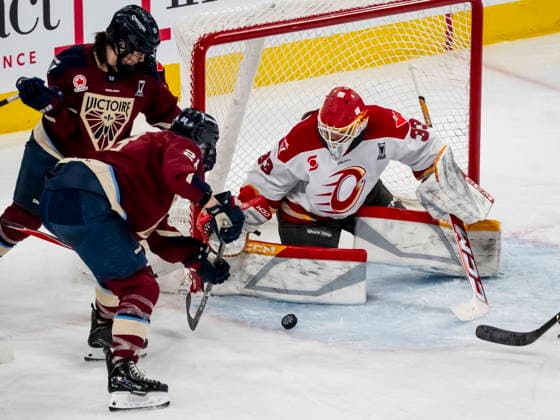 May 16, 2026, Laval, Pq, Canada: Ottawa Charge goaltender Gwyneth Philips (33) makes a save on Montreal Victoire s Catherine Dubois (28) and Jessica DiGirolamo (22) during first period PWHL playoff hockey action in Laval, Que., on Saturday, May 16, 2026. Canada News - May 16, 2026  - ZUMAc35_ 20260516_zaf_c35_001 Copyright: xChristopherxKatsarovx