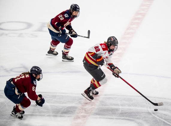 May 16, 2026, Laval, Pq, Canada: Ottawa Charge s Taylor House (22) moves the puck past Montreal Victoire s Nicole Gosling (61) and Catherine Dubois (28) during first period PWHL playoff hockey action in Laval, Que., on Saturday, May 16, 2026. Canada News - May 16, 2026  - ZUMAc35_ 20260516_zaf_c35_005 Copyright: xChristopherxKatsarovx