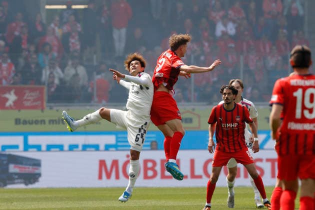 Fussball, 1. Bundesliga, 34. Spieltag, 2025 2026, 1. FC Heidenheim vs. 1. FSV Mainz 05, 16.05.2026, Voith-Arena, Heidenheim, Deutschland, Kaishu SANO 1. FSV Mainz 05 6 li. im Luftkampf mit Jan SCHÖPPNER 1. FC Heidenheim 3 Heidenheim Voith-Arena Baden-Württemberg Deutschland Copyright: xGaetanoxDixRosax