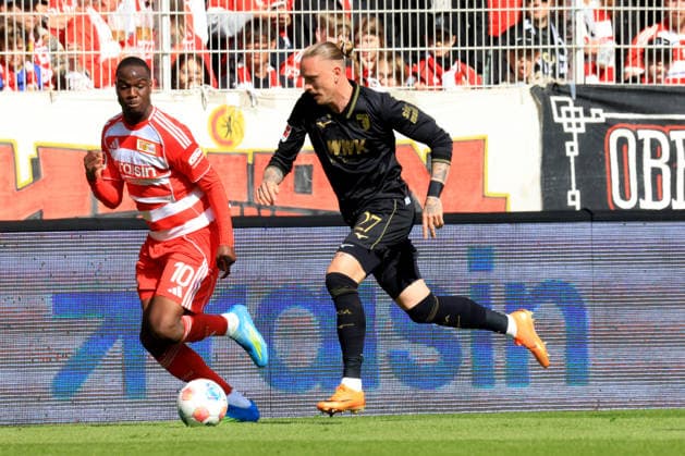 DEU, DFL, 1. FBL, 1.FC Union vs. FC Augsburg, 16.05.2026, Stadion Alte Foersterei, Berlin, DEU, DFL, 1. FBL, 1.FC Union vs. FC Augsburg, im Bild: Ilyas Ansah (1.FC Union Berlin 10), Marius Wolf (FC Augsburg 27) DFL - regulations prohibit any use of Photographs as image sequences and or quasi-video