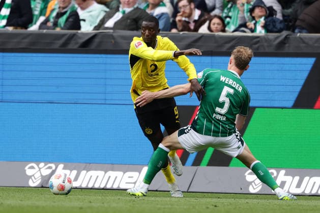 Bremen, Germany, 16.05.26, Serhou Guirassy (Borussia Dortmund) und Amos Pieper (Werder Bremen) im Zweikampf während des Spiels der 1. Bundesliga zwischen Werder Bremen - Borussia Dortmund im Weserstadion in Bremen. (Photo by Joachim Bywaletz) DFB DFL REGULATIONS PROHIBIT ANY USE OF PHOTOGRAPHS AS IMAGE SEQUENCES AND OR QUASI-VIDEO. Copyright: JoachimxBywaletz xJB-Sportfoto