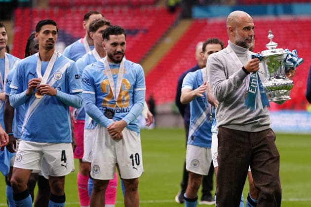 Chelsea v Manchester City - Emirates FA Cup Final Josep Guardiola, manager of Manchester City, holds the FA Cup trophy during the Emirates FA Cup Final match between Chelsea and Manchester City at Wembley Stadium in London, United Kingdom, on May 16, 2026. United Kingdom  Copyright: xNewsxImagesx originalFilename:cosgrove-emirates260516_npZSS.jpg