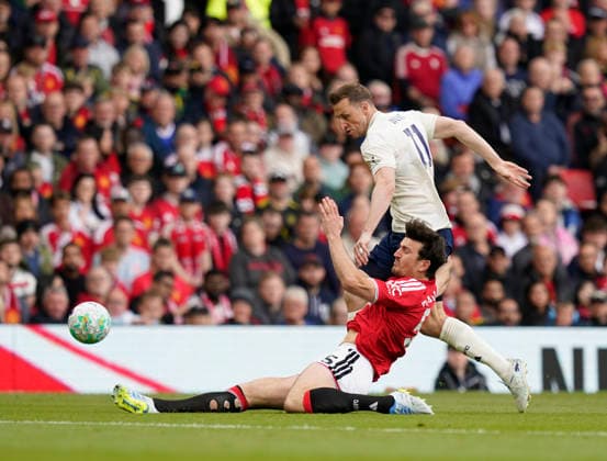 Manchester, England, 17th May 2026. Harry Maguire of Manchester United, ManU tackles Chris Wood of Nottingham Forest during the Manchester United vs Nottingham Forest Premier League match at Old Trafford, Manchester. Picture credit should read: Andrew Yates Sportimage EDITORIAL USE ONLY. No use with unauthorised audio, video, data, fixture lists, club league logos or live services. Online in-match use limited to 120 images, no video emulation. No use in betting, games or single club league player publications. SPI_035_AY_Man_Utd_Forest SPI-4806-0035