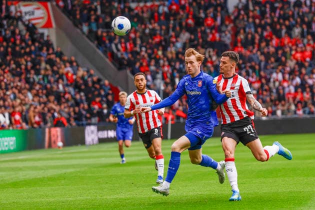 2026-05-17 PSV v FC Twente - Dutch Eredivisie EINDHOVEN, NETHERLANDS - MAY 17: Mats Rots of FC Twente, Dennis Man of PSV during the Dutch Eredivisie match between PSV and FC Twente at Philips Stadion on May 17, 2026 in Eindhoven, Netherlands. Eindhoven Philips Stadion Netherlands Content not available for redistribution in The Netherlands directly or indirectly through any third parties. Copyright: xBenxGalx
