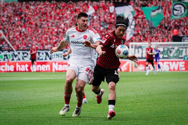 2. Bundesliga: Hannover 96 vs. 1. FC Nürnberg, 17.05.2026 Luka Lochoshvili (1. FC Nürnberg, 24) gegen Daisuke Yokota (Hannover 96, 18) im Zweikampf; Fußball, 2. Bundesliga, 34. Spieltag: Hannover 96 vs. 1. FC Nürnberg am 17.05.2026 in der Heinz von Heiden Arena, Hannover DFL REGULATIONS PROHIBIT ANY USE OF PHOTOGRAPHS AS IMAGE SEQUENCES AND OR QUASI-VIDEO.