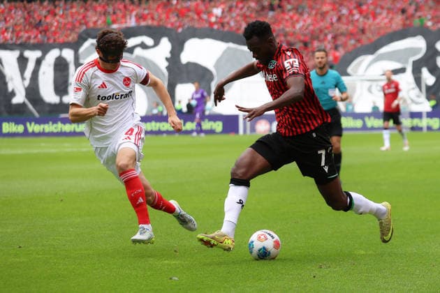 17.05.2026, xtgx, Fussball 2.Bundesliga, Hannover 96 - 1.FC Nürnberg v.l. Fabio Gruber (1.FC Nuernberg) Mustapha Bundu (Hannover 96) Zweikampf, Aktion, action, battle for the ball (DFL DFB REGULATIONS PROHIBIT ANY USE OF PHOTOGRAPHS as IMAGE SEQUENCES and or QUASI-VIDEO) Hannover