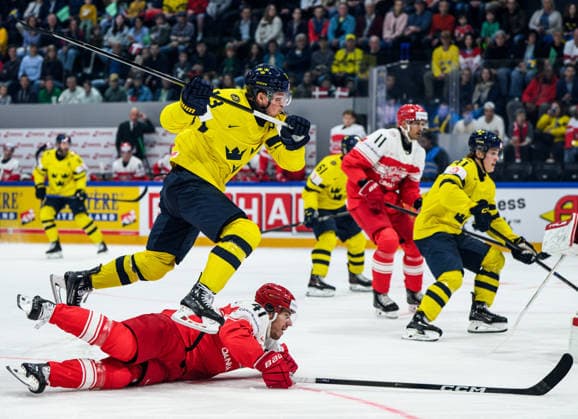 260517 Lucas Raymond of Sweden and Jesper Jensen-Aabo during the 2026 IIHF Ice hockey, Eishockey World Championship, WM, Weltmeisterschaft match between Denmark and Sweden on May 17, 2026 in Fribourg. Photo: Jesper Zerman BILDBYRAN kod JZ JZ0716 ishockey ice hockey ishockey-vm 2026 vm 2026 iihf world championship danmark denmark sverige sweden bbeng Copyright: JESPERxZERMAN BB260517JZ032