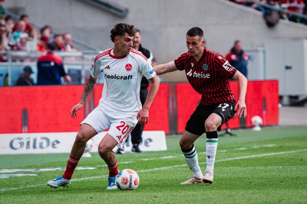 2. Bundesliga: Hannover 96 vs. 1. FC Nürnberg, 17.05.2026 Javier Fernandez (1. FC Nürnberg, 20) gegen Bastian Allgeier (Hannover 96, 17); Fußball, 2. Bundesliga, 34. Spieltag: Hannover 96 vs. 1. FC Nürnberg am 17.05.2026 in der Heinz von Heiden Arena, Hannover DFL REGULATIONS PROHIBIT ANY USE OF PHOTOGRAPHS AS IMAGE SEQUENCES AND OR QUASI-VIDEO.