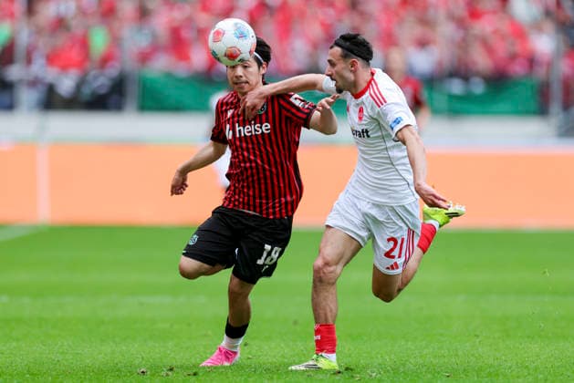 Daisuke Yokota (Hannover 96) und Berkay Yilmaz (1. FC Nuernberg) kaempfen um den Ball, 2. Bundesliga, Hannover 96 v 1. FC Nürnberg, Heinz von Heiden Arena am 17. May 2026 in Hannover, Deutschland. (Foto von Marco Steinbrenner DeFodi Images) Daisuke Yokota (Hannover 96) und Berkay Yilmaz (1. FC Nuernberg) battle for the ball, 2. Bundesliga, Hannover 96 v 1. FC Nürnberg, Heinz von Heiden Arena, May 17, 2026 in Hanover, Germany. (Photo by Marco Steinbrenner DeFodi Images) -