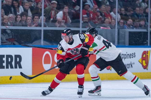 ZURICH, SWITZERLAND - MAY 17: Mario Huber (Austria, 96) in the battle for the puck with Csanad Ravasz (Hungary, 45) during the Preliminary Round - Group A Match 13 between Austria and Hungary at the IIHF Ice hockey, Eishockey World Championship, WM, Weltmeisterschaft 2026, Swiss Life Arena on May 17, 2026 in Zurich, Switzerland. Zurich Switzerland Copyright: xTimoxSteinx