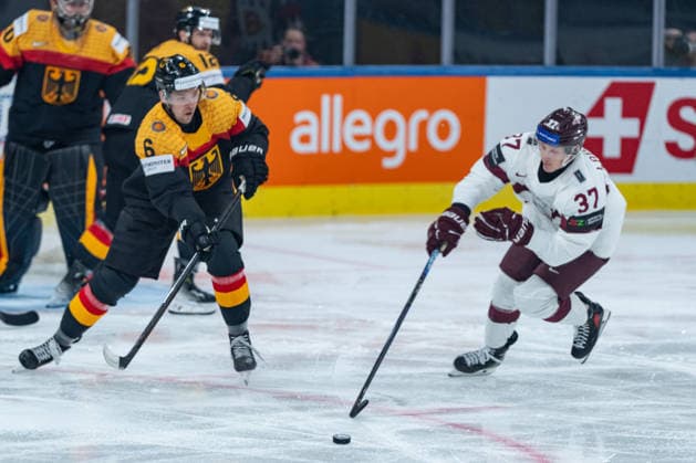 ZURICH, SWITZERLAND - MAY 17: Kai Wissmann (Germany, 6) in the battle for the puck with Oskars Lapinskis (Latvia, 37) during the Preliminary Round - Group A Match 15 between Germany and Latvia at the IIHF Ice hockey, Eishockey World Championship, WM, Weltmeisterschaft 2026, Swiss Life Arena on May 17, 2026 in Zurich, Switzerland. Zurich Switzerland Copyright: xTimoxSteinx