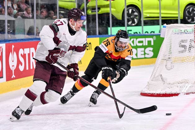 ZURICH, SWITZERLAND - MAY 17: Oskars Cibulskis of Latvia and Samuel Dove-McFalls of Germany battle for the puck during the 2026 IIHF Ice hockey, Eishockey World Championship, WM, Weltmeisterschaft Switzerland game between Germany and Latvia at Swiss Life Arena on May 17, 2026 in Zurich, Zurich. Zurich Swiss Life Arena Zurich Switzerland Copyright: xJustPictures.ch AndreaxBrancax jp-en-EuSpIm-JP7_ANB_Ger_Lat_17052026_6742