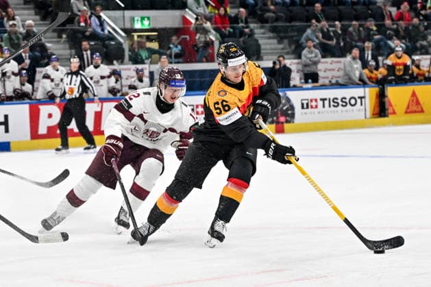 ZURICH, SWITZERLAND - MAY 17: Manuel Wiederer of Germany protects the puck from Glebs Prohorenkovs of Latvia during the 2026 IIHF Ice hockey, Eishockey World Championship, WM, Weltmeisterschaft Switzerland game between Germany and Latvia at Swiss Life Arena on May 17, 2026 in Zurich, Zurich. Zurich Swiss Life Arena Zurich Switzerland Copyright: xJustPictures.ch AndreaxBrancax jp-en-EuSpIm-JP7_ANB_Ger_Lat_17052026_6968