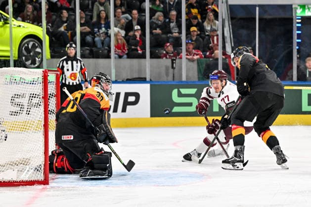 ZURICH, SWITZERLAND - MAY 17: Kristaps Zile of Latvia tries to score against goalkeeper Philipp Grubauer of Germany L) during the 2026 IIHF Ice hockey, Eishockey World Championship, WM, Weltmeisterschaft Switzerland game between Germany and Latvia at Swiss Life Arena on May 17, 2026 in Zurich, Zurich. Zurich Swiss Life Arena Zurich Switzerland Copyright: xJustPictures.ch AndreaxBrancax jp-en-EuSpIm-JP7_ANB_Ger_Lat_17052026_7641