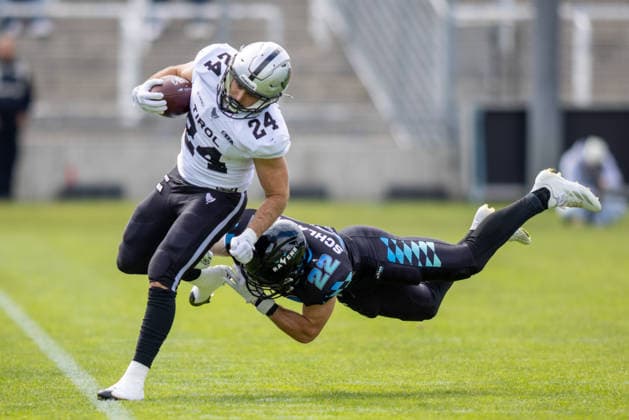 Jonas Guertnke (Munich Ravens, 24) runs with the ball and is tackled by Marcos Schlabitz (Munich Ravens, 22) Munich Ravens vs Raiders Tirol, American Football, European Football Alliance (EFA), Week 1, 2026, 17.05.2026, Munich Grünwalder Stadion Munich Germany Copyright: xFootxBowl BjörnxKeckerx