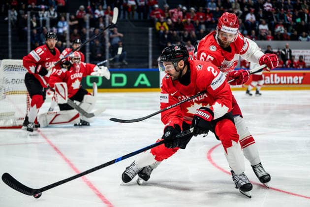260518 Dylan Demelo of Canada and Christian Wejse of Denmark during the 2026 IIHF Ice hockey, Eishockey World Championship, WM, Weltmeisterschaft match between Canada and Denmark on May 18, 2026 in Fribourg. Photo: Jesper Zerman BILDBYRAN kod JZ JZ0718 ishockey ice hockey ishockey-vm 2026 vm 2026 iihf world championship kanada canada danmark denmark canada kanada bbeng danmark denmark Copyright: JESPERxZERMAN BB260518JZ092
