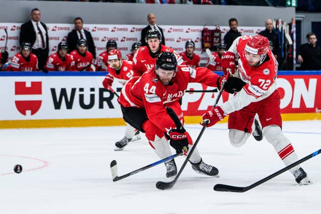 260518 Morgan Rielly of Canada and Phillip Schultz of Denmark during the 2026 IIHF Ice hockey, Eishockey World Championship, WM, Weltmeisterschaft match between Canada and Denmark on May 18, 2026 in Fribourg. Photo: Jesper Zerman BILDBYRAN kod JZ JZ0718 ishockey ice hockey ishockey-vm 2026 vm 2026 iihf world championship kanada canada danmark denmark canada kanada bbeng danmark denmark Copyright: JESPERxZERMAN BB260518JZ098