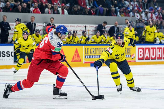 260518 David Tomasek of Czech Republic and Oliver Ekman-Larsson of Sweden during the 2026 IIHF Ice hockey, Eishockey World Championship, WM, Weltmeisterschaft match between Sweden and Czech Republic on May 18, 2026 in Fribourg. Photo: Jesper Zerman BILDBYRAN kod JZ JZ0719 ishockey ice hockey ishockey-vm 2026 vm 2026 iihf world championship sverige sweden tjeckien czech republic bbeng Copyright: JESPERxZERMAN BB260518JZ110