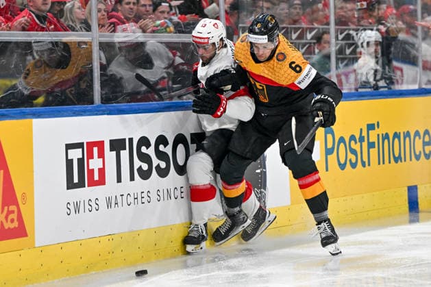 ZURICH, SWITZERLAND - MAY 18: Nico Hischier of Switzerland and Kai Wissmann of Germany in a battle along the boards during the 2026 IIHF Ice hockey, Eishockey World Championship, WM, Weltmeisterschaft Switzerland game between Germany and Switzerland at Swiss Life Arena on May 18, 2026 in Zurich, Zurich. Zurich Swiss Life Arena Zurich Switzerland Copyright: xJustPictures.ch AndreaxBrancax jp-en-EuSpIm-JP7_ANB_Ger_Sui_18052026_0540