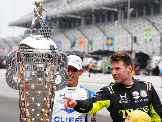 INDIANAPOLIS, IN - MAY 18: From left to right IndyCar, Indy Car, IRL, USA drivers Hello Castroneves and Will Power look at the Borg Warner Trophy before a group driver photo is taken before practice for the 110th Running of the Indianapolis 500 on May 18th, 2026, at the Indianapolis Motor Speedway in Indianapolis, Indiana. (Photo by Brian Spurlock Icon Sportswire) AUTO: MAY 18 NTT IndyCar Series Indianapolis 500 Practice EDITORIAL USE ONLY Icon26051850016