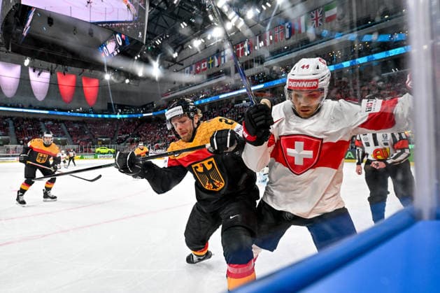 ZURICH, SWITZERLAND - MAY 18: Pius Suter of Switzerland and Leon Huttl of Germany battle along the boards during the 2026 IIHF Ice hockey, Eishockey World Championship, WM, Weltmeisterschaft Switzerland game between Germany and Switzerland at Swiss Life Arena on May 18, 2026 in Zurich, Zurich. Zurich Swiss Life Arena Zurich Switzerland Copyright: xJustPictures.ch AndreaxBrancax jp-en-EuSpIm-JP7_ANB_Ger_Sui_18052026_5189
