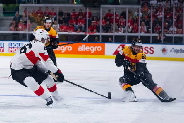 ZURICH, SWITZERLAND - MAY 18: Parker Tuomie (Germany, 62) in the battle for the puck with Janis Moser (Switzerland, 86) during the Preliminary Round - Group A Match 19 between Germany and Switzerland at the IIHF Ice hockey, Eishockey World Championship, WM, Weltmeisterschaft 2026, Swiss Life Arena on May 18, 2026 in Zurich, Switzerland. Zurich Switzerland Copyright: xTimoxSteinx