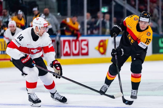 ZURICH, SWITZERLAND - MAY 18: Stefan Loibl (Germany, 15) and Dean Kukan (Switzerland, 14) during the Preliminary Round - Group A Match 19 between Germany and Switzerland at the IIHF Ice hockey, Eishockey World Championship, WM, Weltmeisterschaft 2026, Swiss Life Arena on May 18, 2026 in Zurich, Switzerland. Zurich Switzerland Copyright: xTimoxSteinx