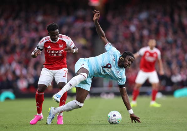 London, England, 18th May 2026. Bukayo Saka of Arsenal tussles with Lesley Ugochukwu of Burnley during the Arsenal vs Burnley Premier League match at the Emirates Stadium, London. Picture credit should read: David Klein Sportimage EDITORIAL USE ONLY. No use with unauthorised audio, video, data, fixture lists, club league logos or live services. Online in-match use limited to 120 images, no video emulation. No use in betting, games or single club league player publications. SPI_019_DK_Arsenal_Burnley SPI-4808-0017