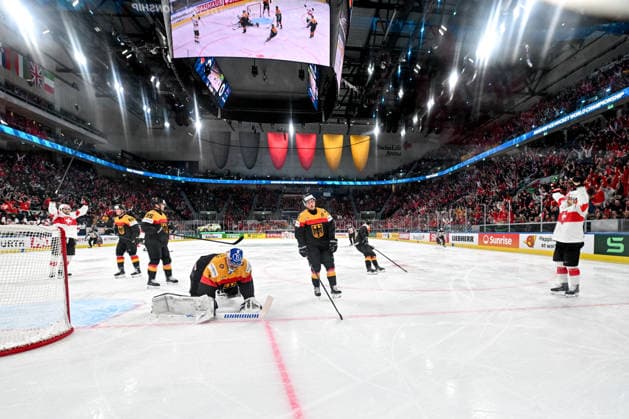 ZURICH, SWITZERLAND - MAY 18: Denis Malgin of Switzerland R) celebrates after scoring a goal against goalkeeper Jonas Stettmer of Germany L) during the 2026 IIHF Ice hockey, Eishockey World Championship, WM, Weltmeisterschaft Switzerland game between Germany and Switzerland at Swiss Life Arena on May 18, 2026 in Zurich, Zurich. Zurich Swiss Life Arena Zurich Switzerland Copyright: xJustPictures.ch AndreaxBrancax jp-en-EuSpIm-JP7_ANB_Ger_Sui_18052026_5352