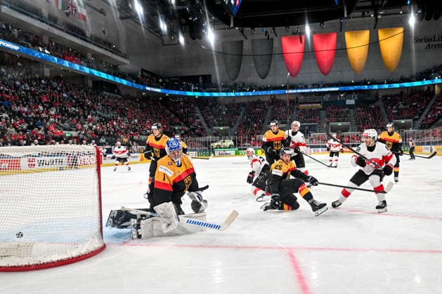 ZURICH, SWITZERLAND - MAY 18: Christoph Bertschy of Switzerland R) scores a goal against goalkeeper Jonas Stettmer of Germany L) during the 2026 IIHF Ice hockey, Eishockey World Championship, WM, Weltmeisterschaft Switzerland game between Germany and Switzerland at Swiss Life Arena on May 18, 2026 in Zurich, Zurich. Zurich Swiss Life Arena Zurich Switzerland Copyright: xJustPictures.ch AndreaxBrancax jp-en-EuSpIm-JP7_ANB_Ger_Sui_18052026_5511