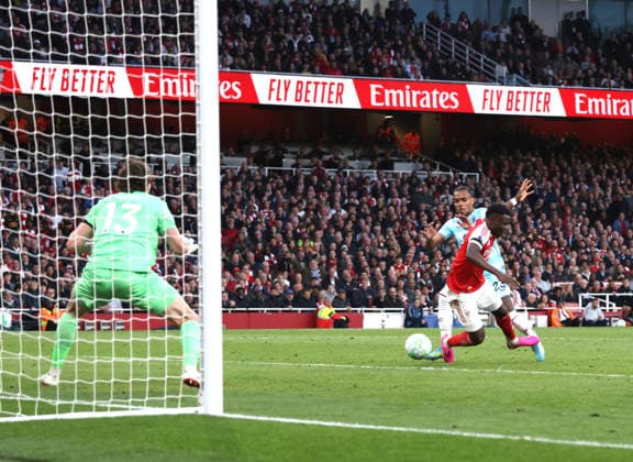 Bukayo Saka (A) goes down under a challenge from Lucas Pires (B) at the Arsenal v Burnley EPL match, at the Emirates Stadium, London, UK on 18th May, 2026. 
