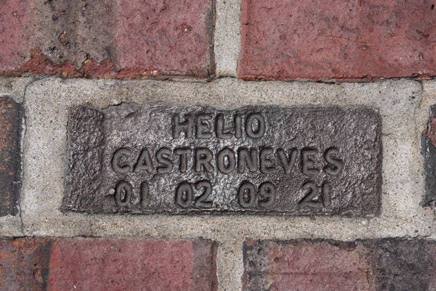 INDIANAPOLIS, IN - MAY 18: A close up of the bronze commemorative brick for Helio Castroneves signifying his four Indy 500 wins which is part of the yard of bricks as seen before practice for the 110th Running of the Indianapolis 500 on May 18th, 2026, at the Indianapolis Motor Speedway in Indianapolis, Indiana. (Photo by Brian Spurlock Icon Sportswire) AUTO: MAY 18 NTT IndyCar, Indy Car, IRL, USA Series Indianapolis 500 Practice EDITORIAL USE ONLY Icon26051850070